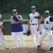 Pioneer players and coaches watch sophomore pitcher Mitchell Tillman warm up during a double header against Saline on Monday, May 20. Daniel Brenner I AnnArbor.com